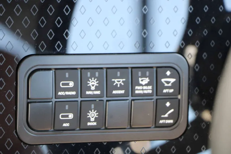Slide: The Image of Close-up of a control panel with various buttons for boat functions. - 42
