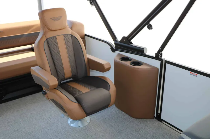 Slide: The Image of A luxurious captain's chair in a modern boat with brown and black upholstery. - 33