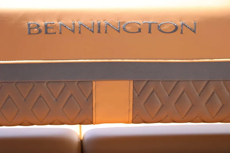 Slide: The Image of Close-up of a seat with embroidered "Bennington" logo and diamond-shaped pattern. - 46
