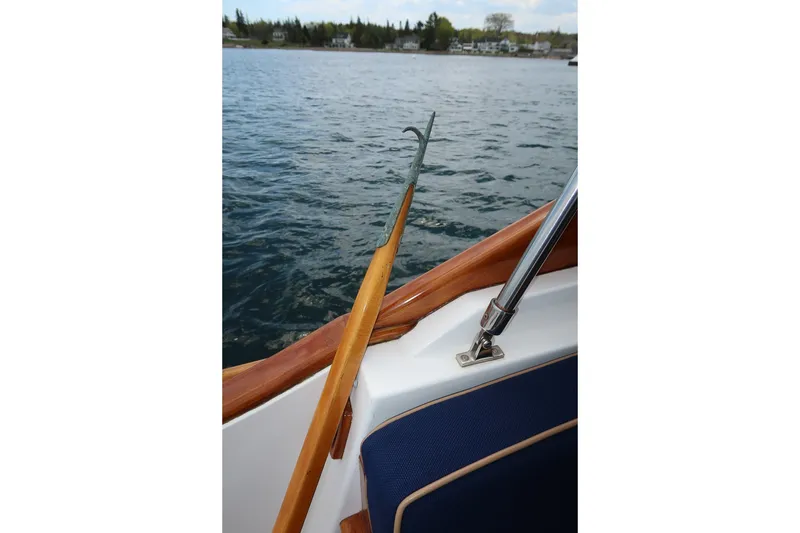 Slide: The Image of CH Marine 38 Runabout boat interior with wooden railing and water view, 2000 model. - 21
