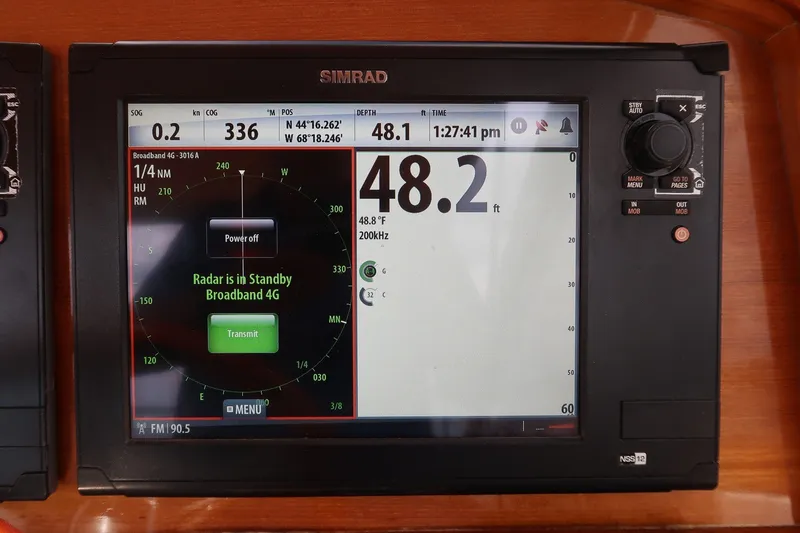 Slide: The Image of Simrad marine navigation display on CH Marine 38 Runabout, showing radar and depth information. - 13