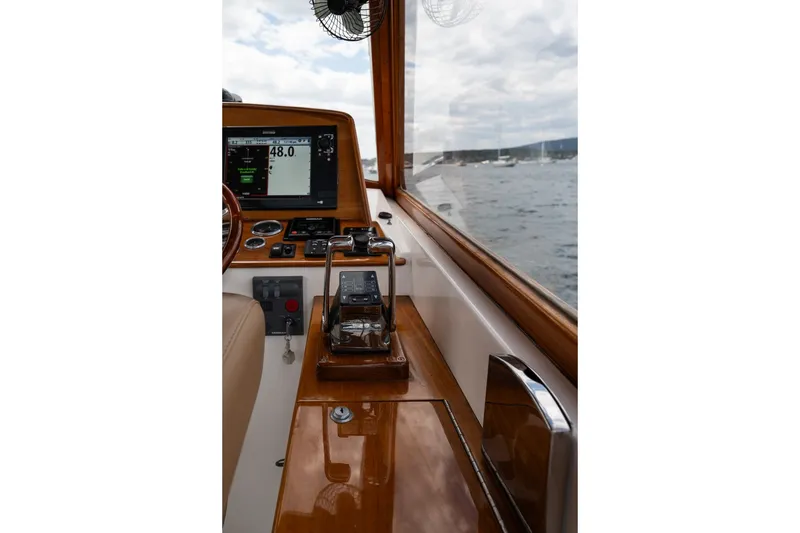 Slide: The Image of Interior view of 2000 CH Marine 38 Runabout boat cockpit with navigation equipment. - 12
