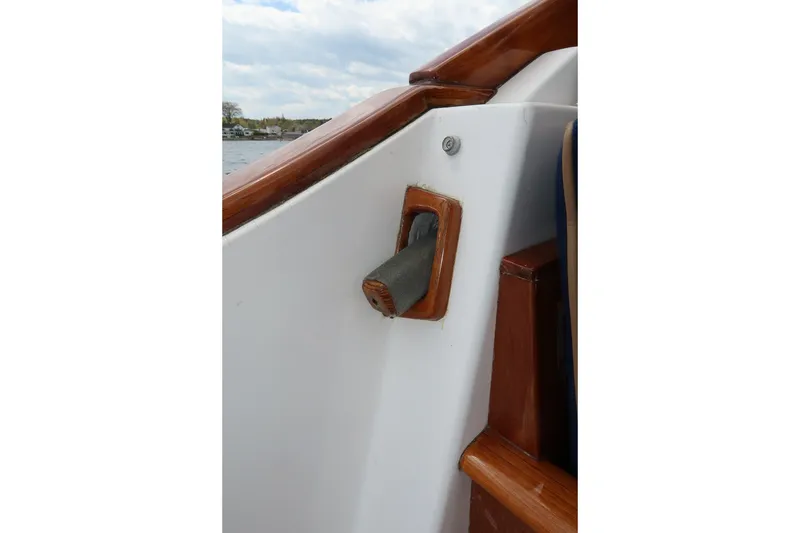 Slide: The Image of Close-up of CH Marine 38 Runabout's wooden and metal boat handle, 2000 model. - 20