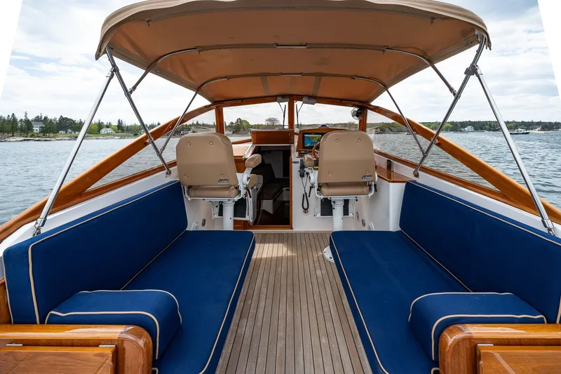 Slide: The Image of Interior view of 2000 CH Marine 38 Runabout boat with blue seating and canopy. - 15