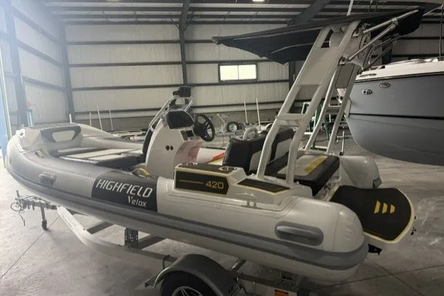 Slide: The Image of 2025 Highfield Velox 420 inflatable boat in a storage facility. - 3