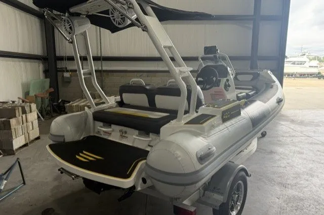 Slide: The Image of Highfield Velox 420 boat, 2025 model, in a storage facility, showcasing sleek design and modern features. - 4