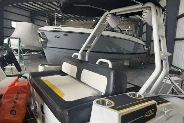 Slide: The Image of 2025 Highfield Velox 420 boat in storage, featuring sleek seating and modern design elements. - 10