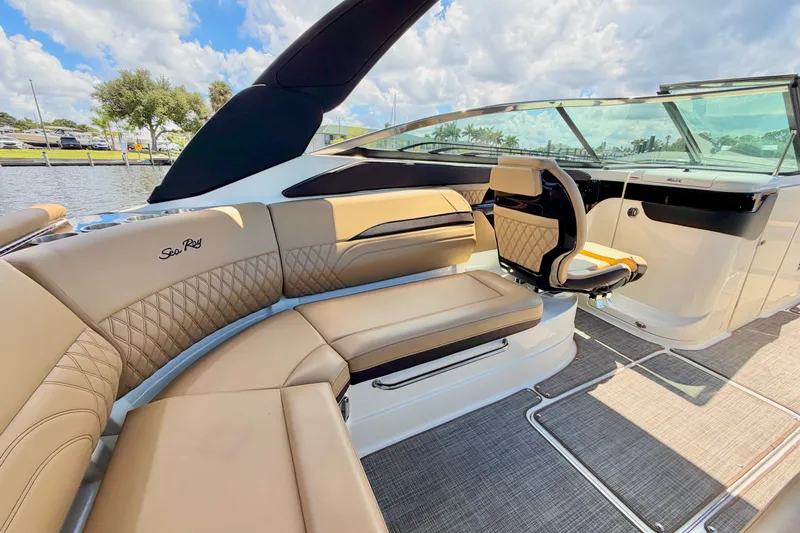 Slide: The Image of 2023 Sea Ray SLX 260 Outboard interior with luxurious seating and modern design. - 13