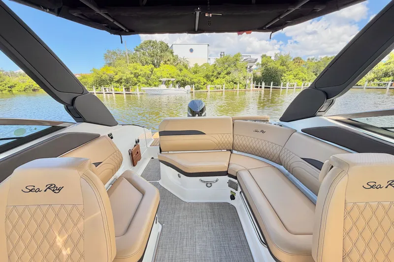 Slide: The Image of Luxurious interior of 2023 Sea Ray SLX 260 Outboard boat with elegant seating and scenic water view. - 8