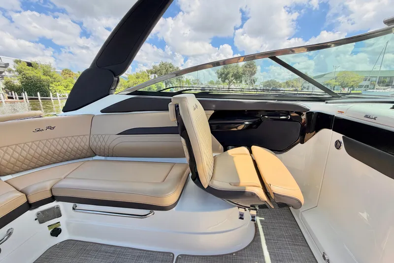 Slide: The Image of 2023 Sea Ray SLX 260 Outboard interior with luxurious seating and sleek design. - 14