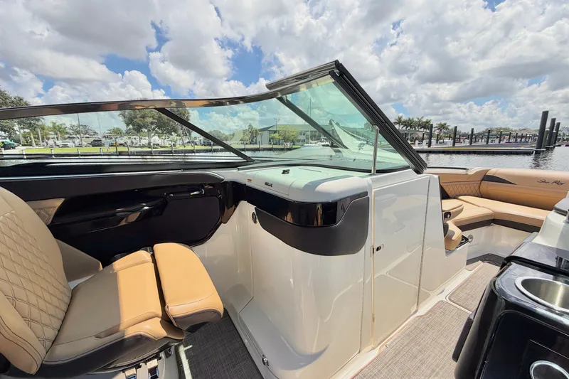 Slide: The Image of 2023 Sea Ray SLX 260 Outboard interior with luxurious seating and sleek design. - 17