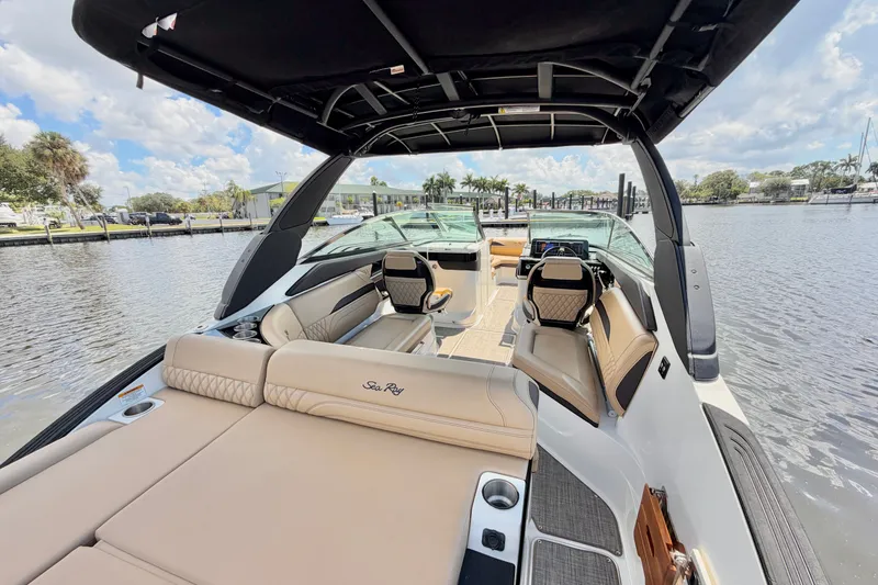 Slide: The Image of 2023 Sea Ray SLX 260 Outboard boat interior with luxurious seating and modern design. - 7
