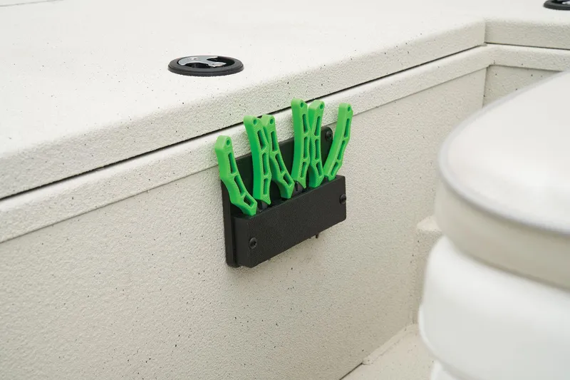 Slide: The Image of Manufacturer Provided Image: Manufacturer Provided Image: Ranger RB190 2025 boat interior with green clips on a storage compartment. - 40
