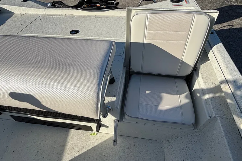 Slide: The Image of 2027 Ranger RB190 boat interior with cushioned seating and storage compartment. - 10