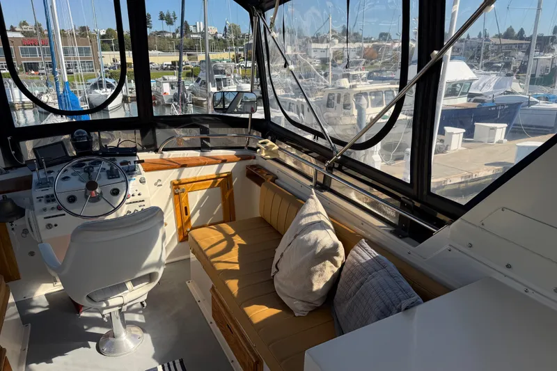 Slide: The Image of Interior of 1984 Californian 43 Cockpit MY yacht with helm and seating area. - 14