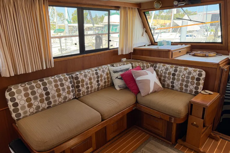 Slide: The Image of Interior of 1984 Californian 43 Cockpit MY yacht with cozy seating and nautical decor. - 18