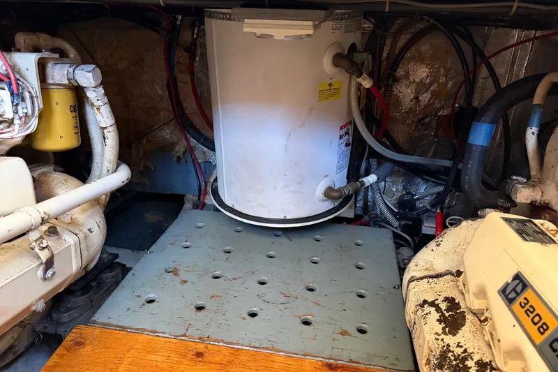 Slide: The Image of Engine room of 1984 Californian 43 Cockpit MY with machinery and wiring. - 58