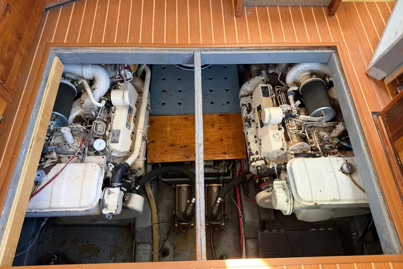 Slide: The Image of Engine room of 1984 Californian 43 Cockpit MY yacht, showcasing dual engines. - 53