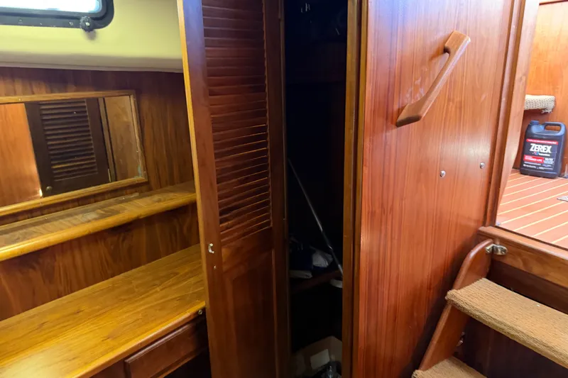 Slide: The Image of 1984 Californian 43 Cockpit MY interior with wooden cabinetry and mirror. - 37
