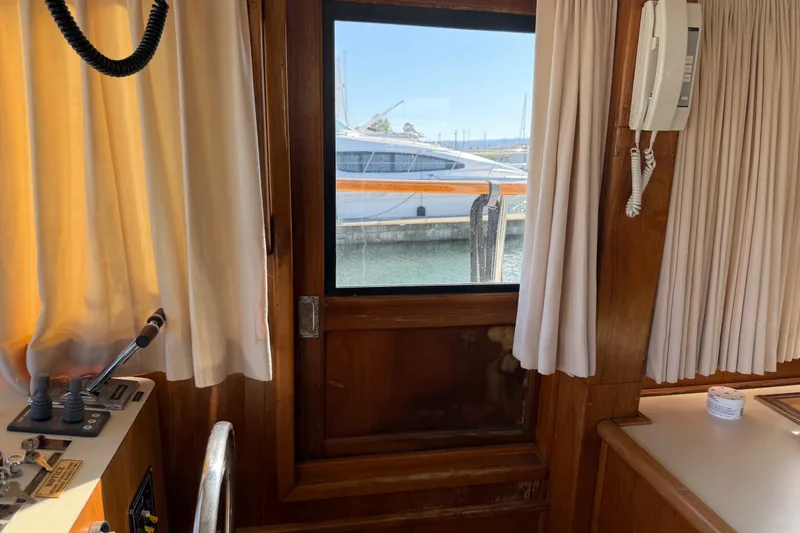 Slide: The Image of Interior view of 1984 Californian 43 Cockpit MY yacht with window and control panel. - 27