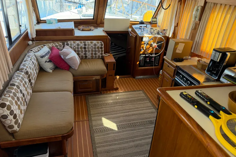 Slide: The Image of Interior of 1984 Californian 43 Cockpit MY yacht with cozy seating and kitchen area. - 17