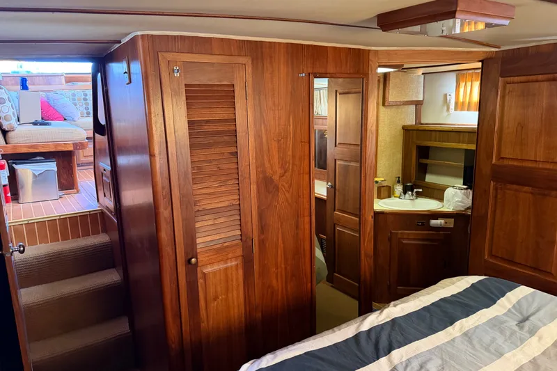 Slide: The Image of Interior of 1984 Californian 43 Cockpit MY yacht with wood paneling and cozy furnishings. - 45