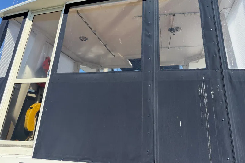 Slide: The Image of 1984 Californian 43 Cockpit MY boat cockpit with black canvas enclosure and visible interior details. - 62