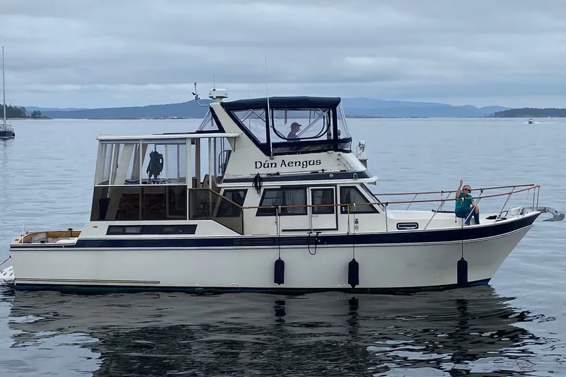 The Image of 1984 Californian 43 Cockpit MY yacht on calm waters, featuring a spacious deck and elegant design. - 0