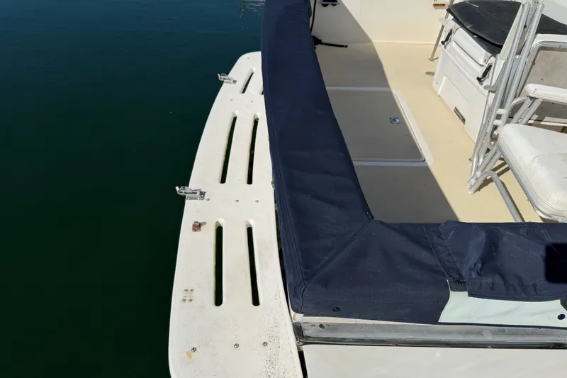 Slide: The Image of 1984 Californian 43 Cockpit MY boat deck with seating and protective cover. - 65