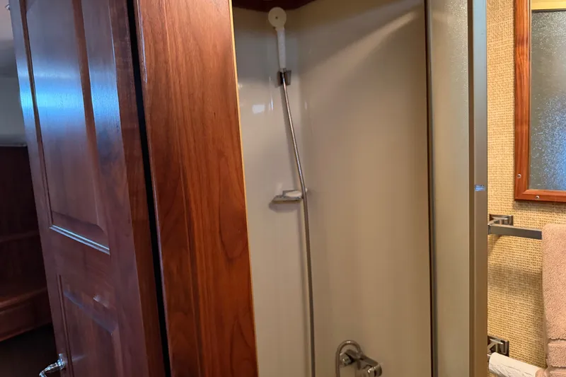 Slide: The Image of 1984 Californian 43 Cockpit MY yacht bathroom with wooden door and shower area. - 35