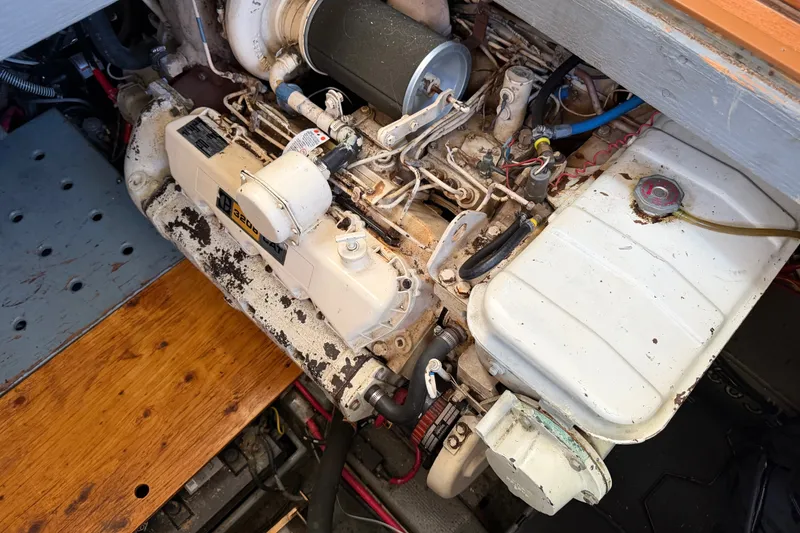 Slide: The Image of Engine compartment of a 1984 Californian 43 Cockpit MY boat, showcasing mechanical components. - 55