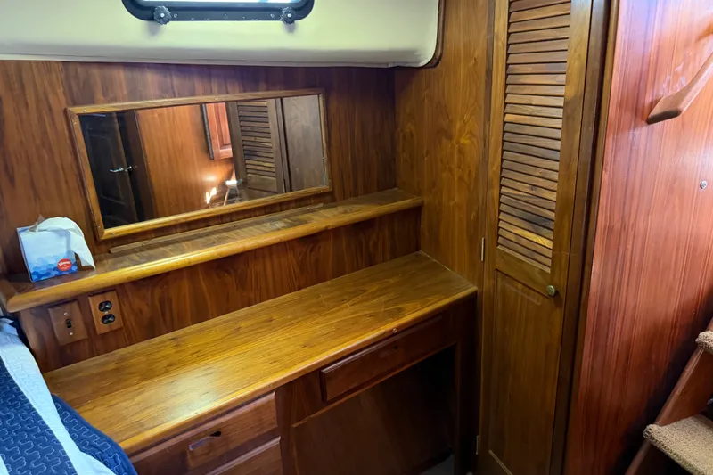 Slide: The Image of 1984 Californian 43 Cockpit MY interior with wooden cabinetry and mirror. - 36
