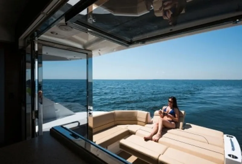 Slide: The Image of Manufacturer Provided Image: Woman relaxing on 2014 Cruisers Yachts 45 Cantius, enjoying ocean view. - 7