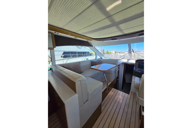 Slide: The Image of Interior of 2014 Cruisers Yachts 45 Cantius with modern seating and panoramic windows. - 22