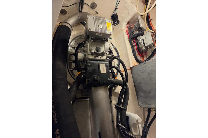 Slide: The Image of Engine room of 2014 Cruisers Yachts 45 Cantius with visible machinery and wiring. - 45