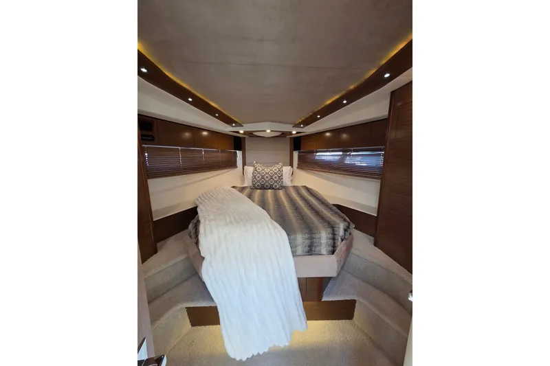 Slide: The Image of Luxurious interior of 2014 Cruisers Yachts 45 Cantius with elegant bedding and ambient lighting. - 21