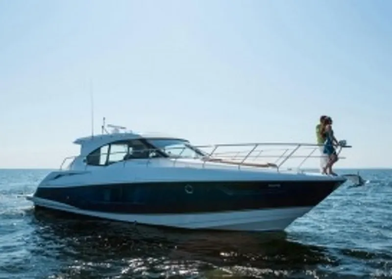 Slide: The Image of Manufacturer Provided Image: 2014 Cruisers Yachts 45 Cantius on open water with people on deck. - 4