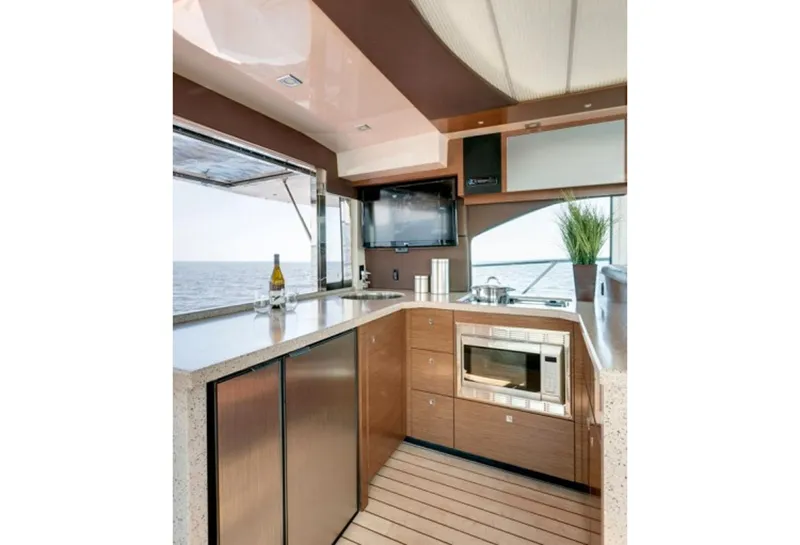 Slide: The Image of Manufacturer Provided Image: Modern kitchen area on 2014 Cruisers Yachts 45 Cantius with ocean view. - 12