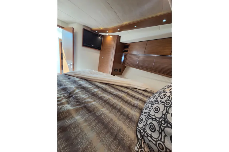 Slide: The Image of Luxurious bedroom interior of 2014 Cruisers Yachts 45 Cantius with modern decor and TV. - 30