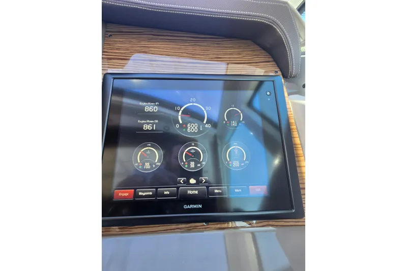 Slide: The Image of A Garmin display on a 2014 Cruisers Yachts 45 Cantius shows various gauges. - 34