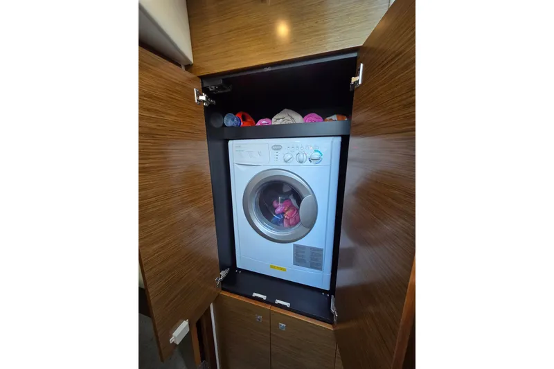 Slide: The Image of Laundry area with washer in 2014 Cruisers Yachts 45 Cantius. - 33