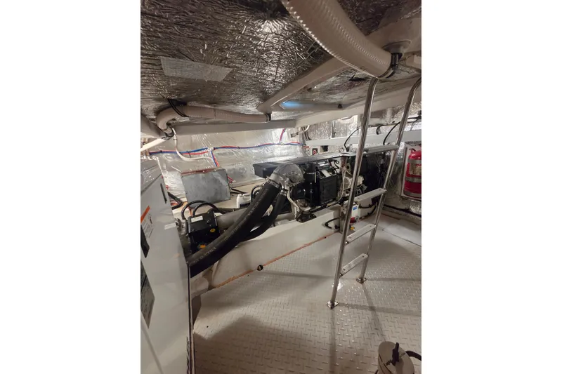 Slide: The Image of Engine room of 2014 Cruisers Yachts 45 Cantius with ladder and equipment. - 40