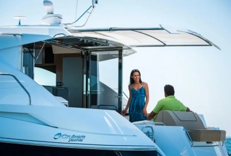 Slide: The Image of Manufacturer Provided Image: 2014 Cruisers Yachts 45 Cantius with people enjoying the deck. - 6