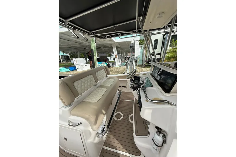 Slide: The Image of 2004 Grady-White Canyon 306 boat interior with seating and helm station. - 39