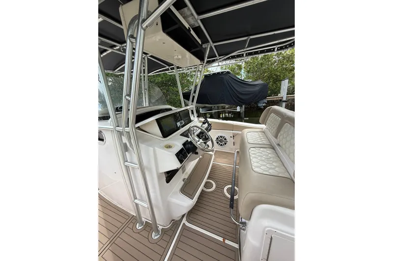 Slide: The Image of 2004 Grady-White Canyon 306 boat interior with steering console and seating. - 40