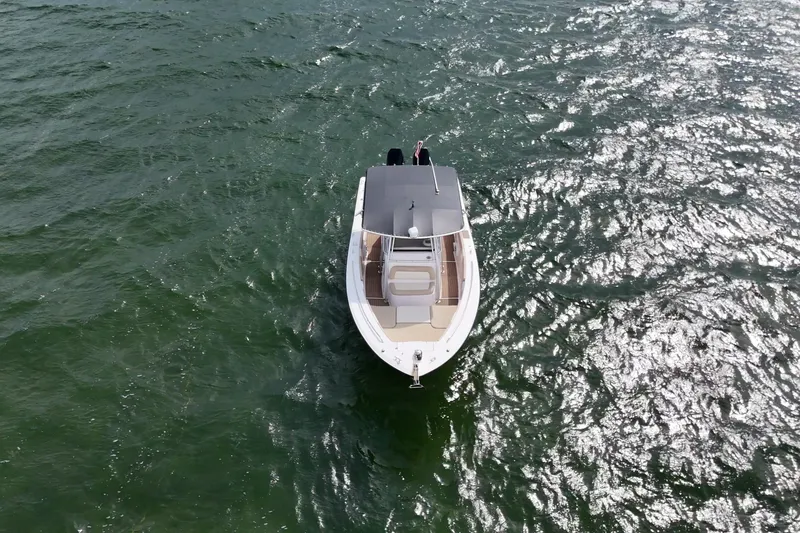 Slide: The Image of Aerial view of 2004 Grady-White Canyon 306 boat on shimmering water. - 3