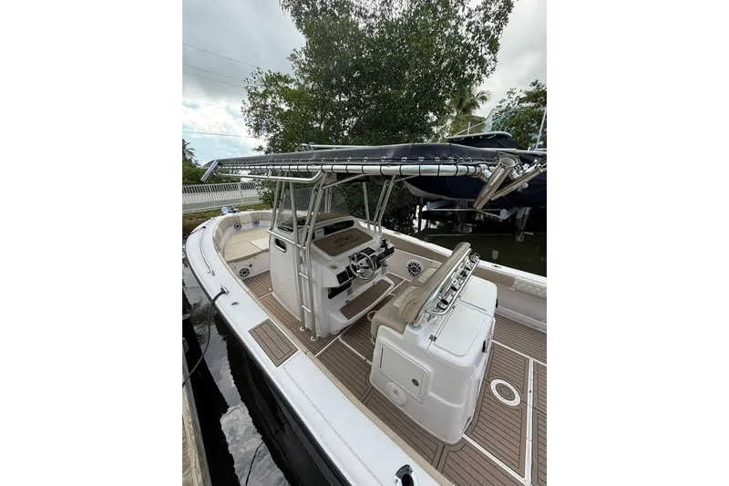 Slide: The Image of 2004 Grady-White Canyon 306 boat with sleek design and spacious deck. - 11