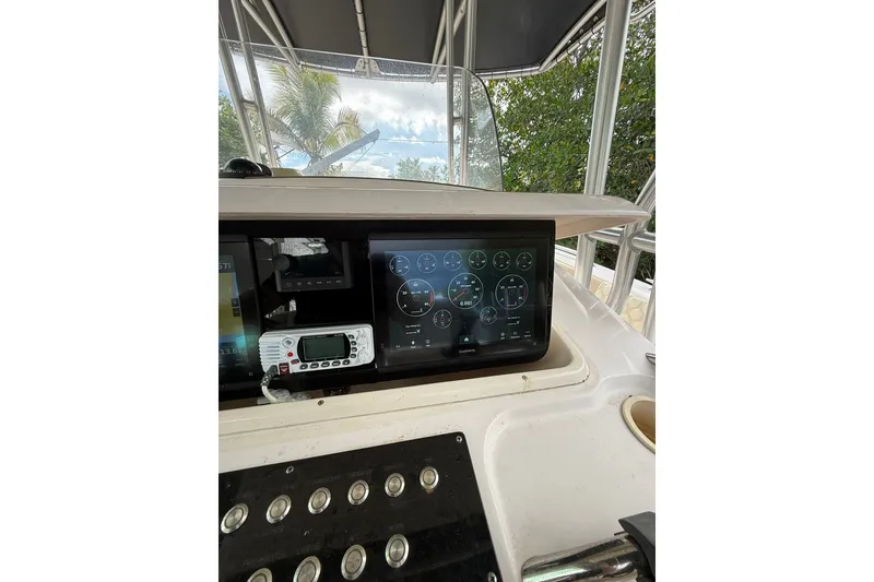 Slide: The Image of Dashboard of a 2004 Grady-White Canyon 306 boat with navigation instruments. - 28