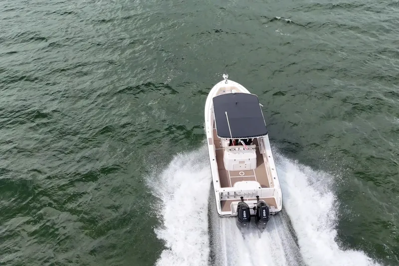 Slide: The Image of Aerial view of 2004 Grady-White Canyon 306 boat cruising on open water. - 2