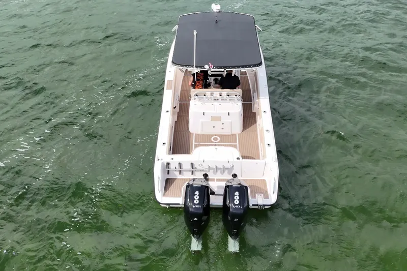 Slide: The Image of 2004 Grady-White Canyon 306 boat with twin 400 V8 engines on water. - 8